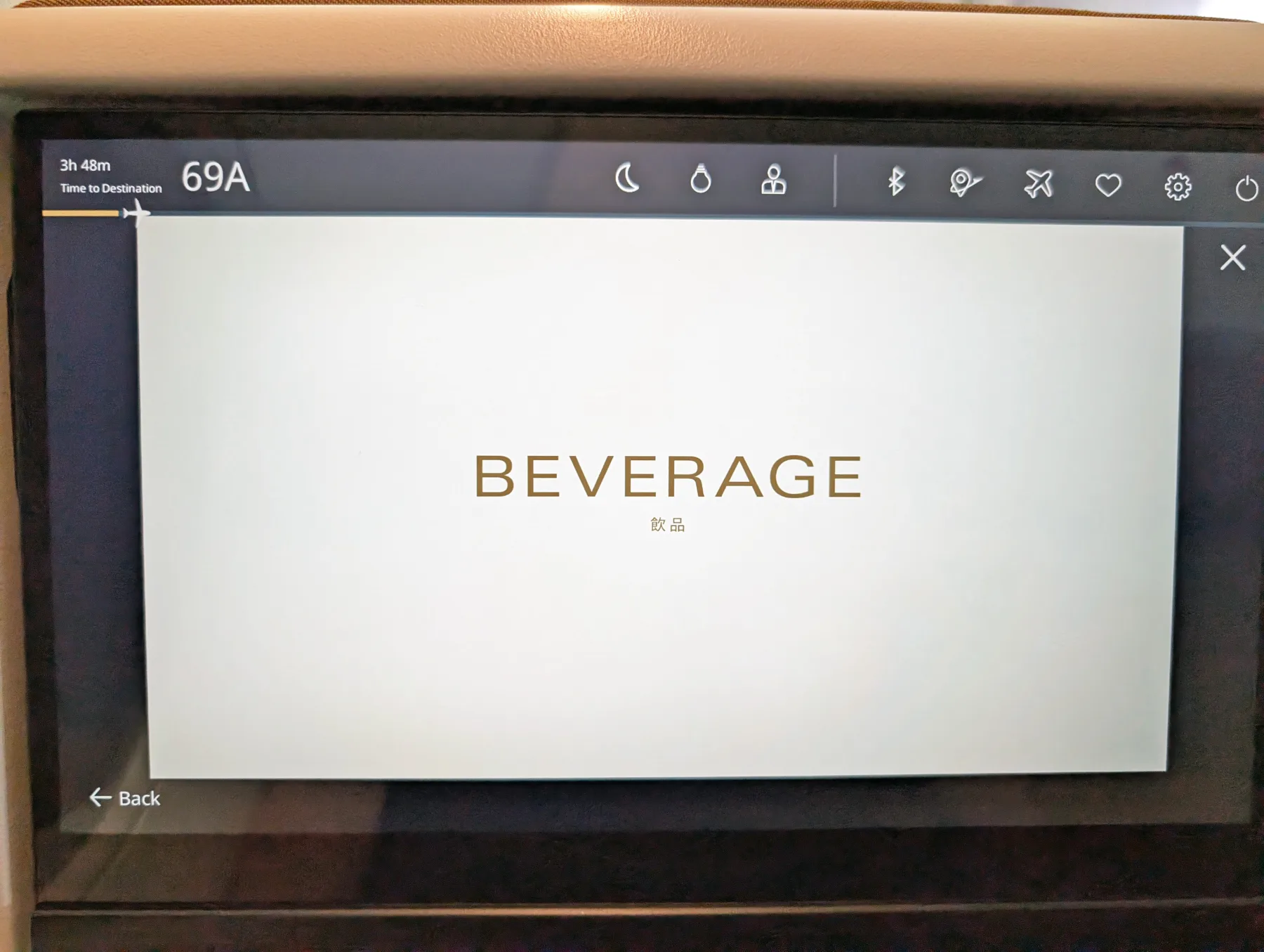 Starlux Airlines Review 2025: Taipei to Singapore 11 Airplane seatback screen displaying the word "BEVERAGE" in English and Chinese, with navigation icons and seat number 69A visible at the top.
